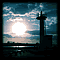 夕日と灯台のシルエット